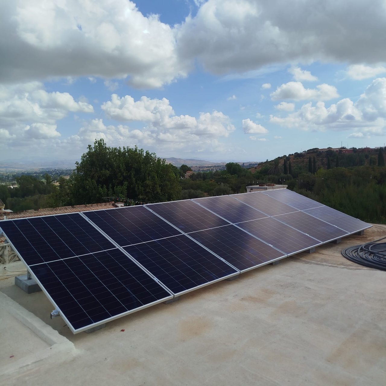 12 AIKO 610 Wp solar panels installed on the flat roof of a home in Alhaurín de la Torre