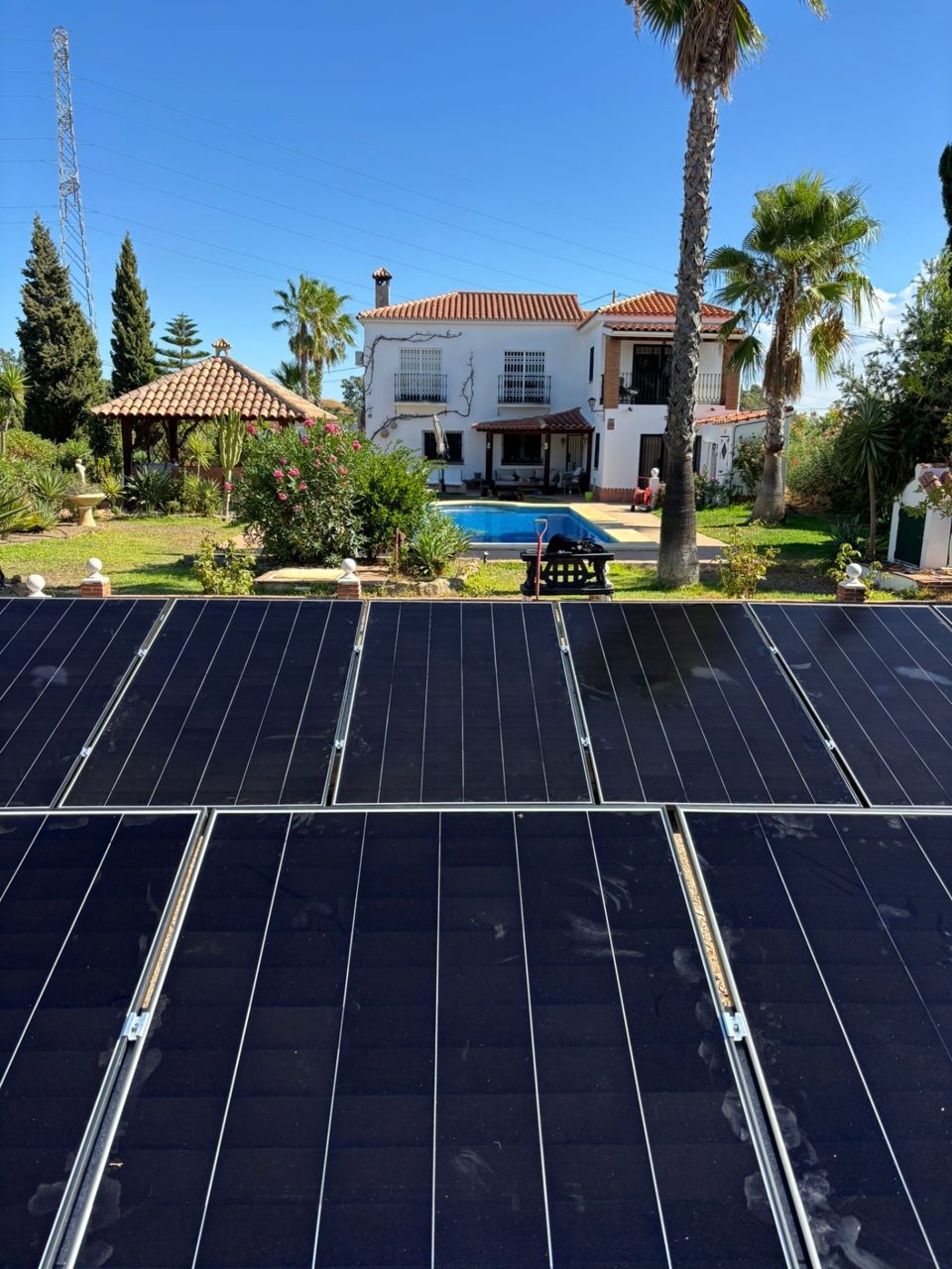 View from the solar panels towards the house and garden in Alhaurín el Grande