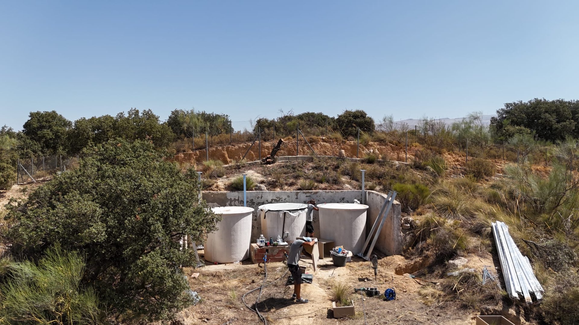 Water tanks and technical area of the off-grid finca in Loja during installation
