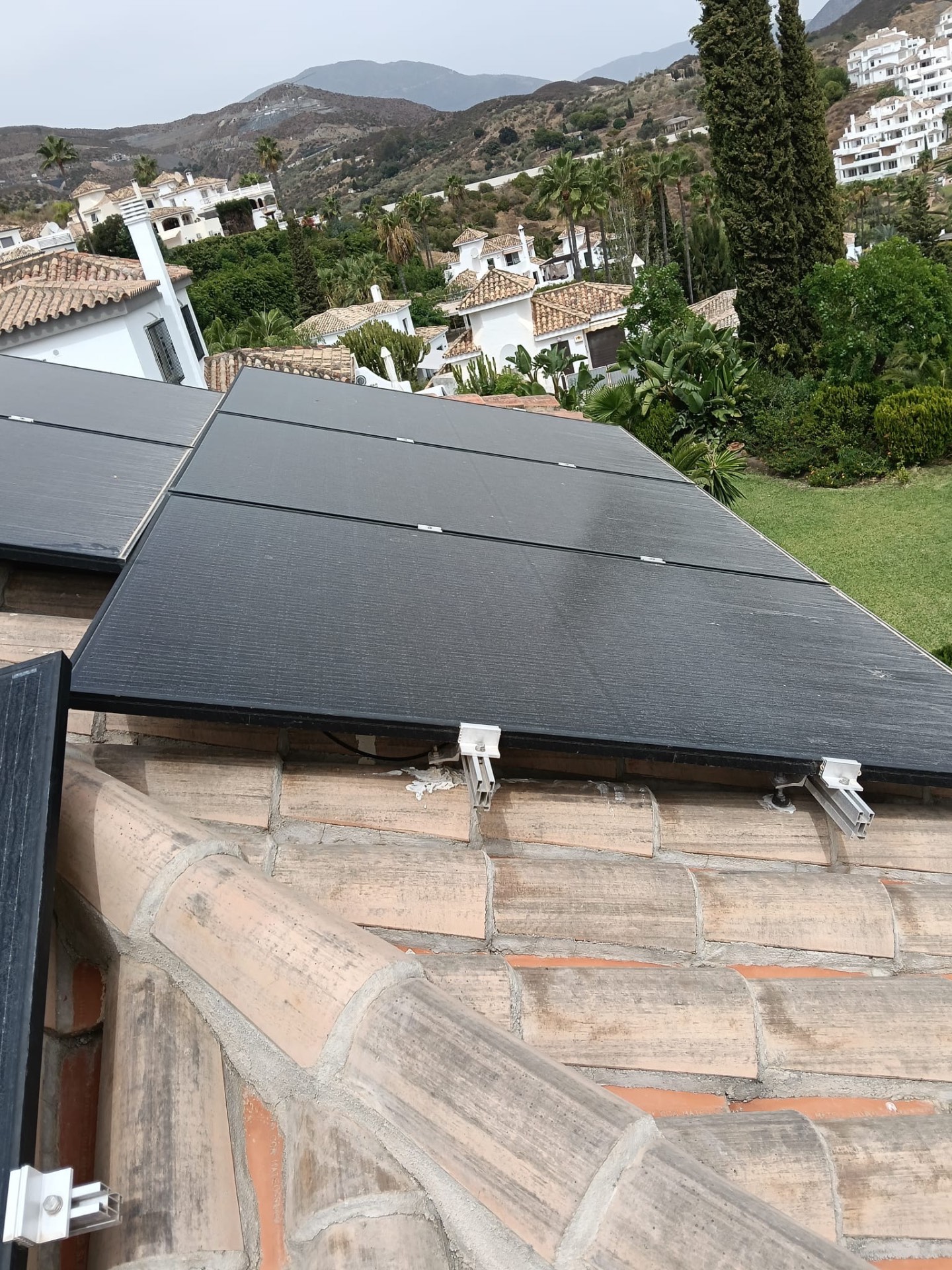 Dust and pollen on solar panels before professional cleaning, Costa del Sol villa roof