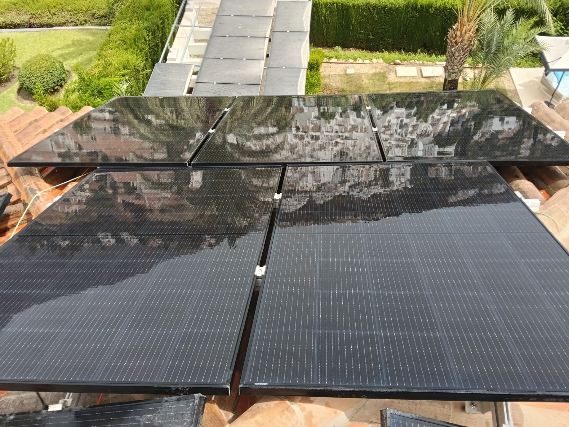 Difference between cleaned and still-dirty solar panels during the job