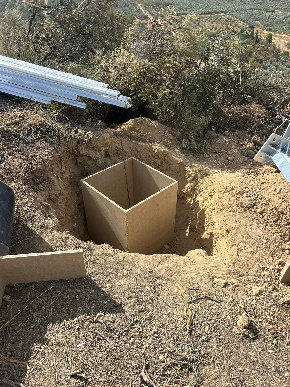 Excavated foundation with formwork for the concrete footing of the solar structure in Loja