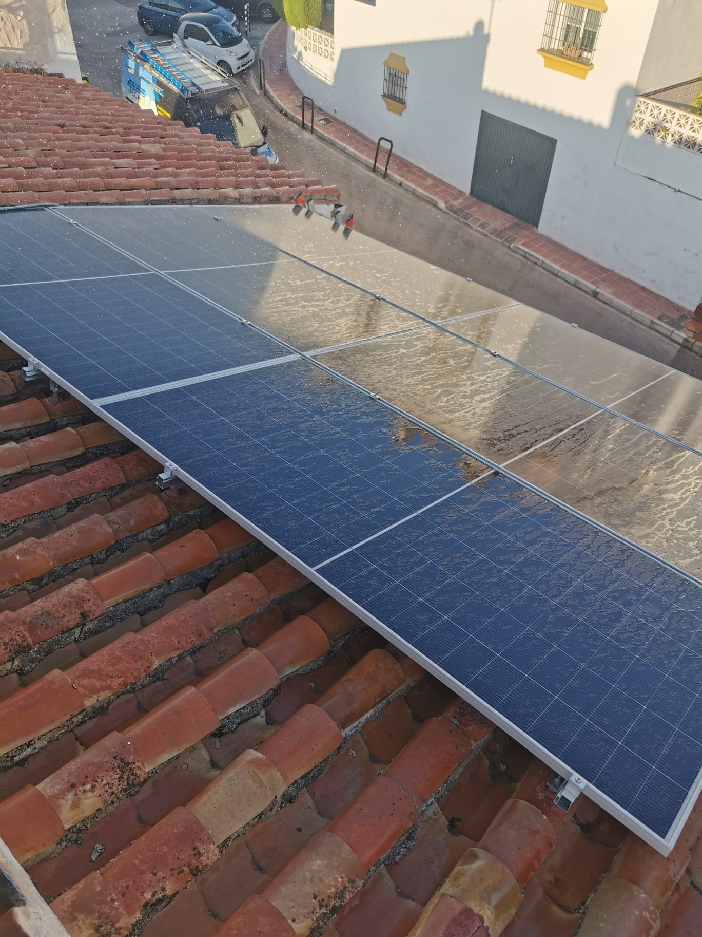 Clean solar panels on a tiled roof after professional cleaning in Vélez-Málaga