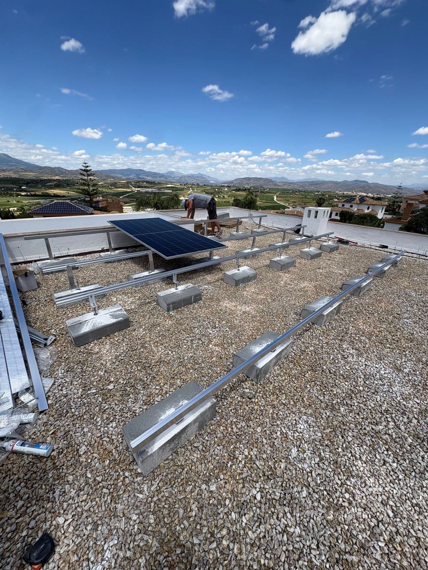 Solarbloc ballast mounting structure being installed on flat roof in Coín, Málaga