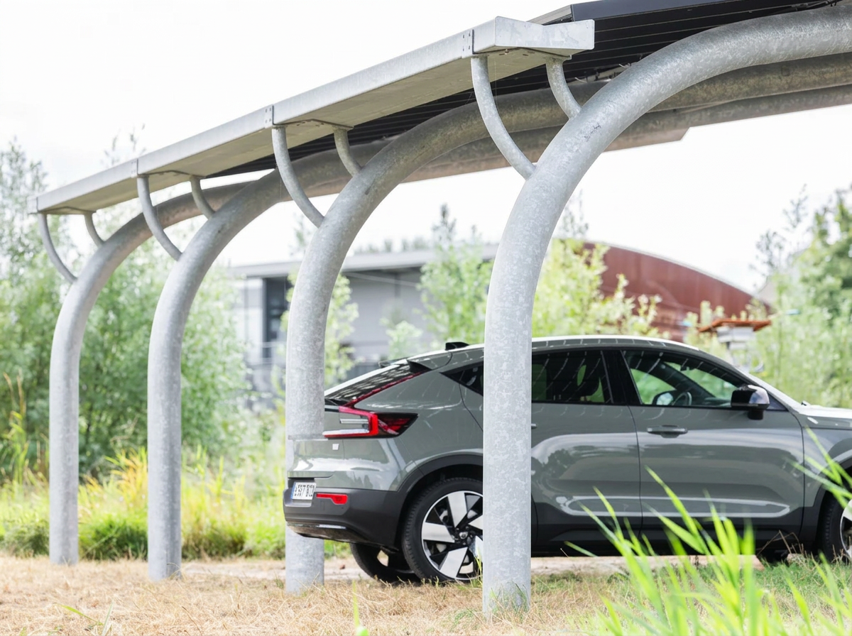 Aerial view of large solar carport installation covering parking area